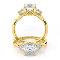 Tracey Twist Three Stone engagement ring with cushion centre in 18kt yellow gold, front view thumbnail 2