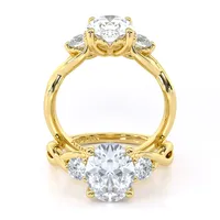 Tracey Twist Three Stone engagement ring with oval centre in 18kt yellow gold, front view thumbnail 2