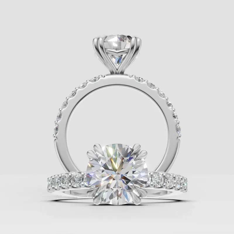 Estelle Double Claw Solitaire and sidestone engagement ring