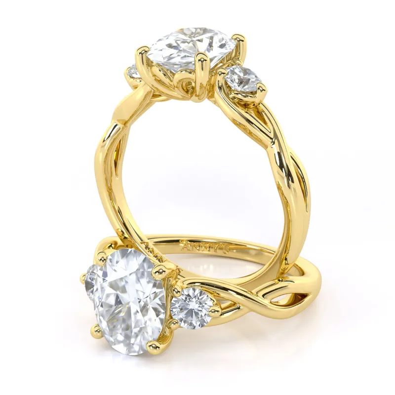 Tracey Twist Three Stone engagement ring with oval centre in 18kt yellow gold