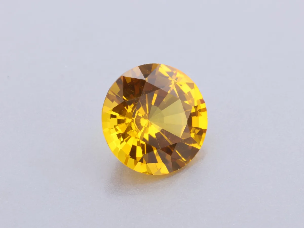 0.88ct Orange Sapphire, Round gemstone