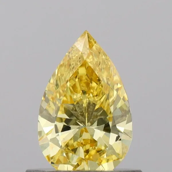 0.63ct PEAR Fancy Vivid Yellow VS1 Coloured Lab diamond