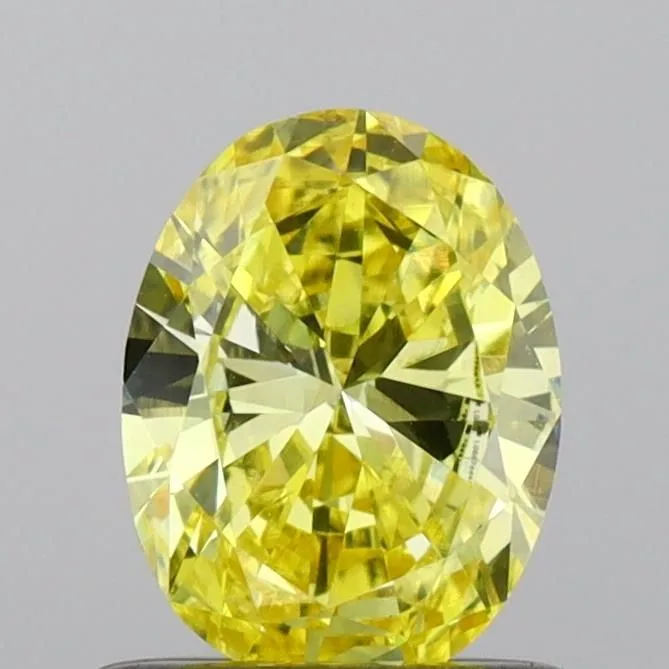 0.65ct OVAL Fancy Vivid Yellow VS1 Coloured Lab diamond